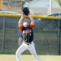 GRAVETTE — Coming off a win a Gravette left fielder Derrick Strzelecki catches a fly ball for an out...