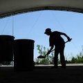    Joe Owens with the Arkansas Music Pavilion in Fayetteville works on cleaning up after the music v...