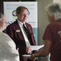Gary Morris, middle, RSVP Director, and Marsha King, left, speak Tuesday with Ellen Thompson, about ...