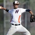  Rogers Heritage starter Hunter Wood delivers a pitch Tuesday during the War Eagles’ game against Be...