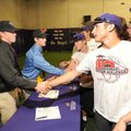 Fayetteville seniors Matt Stelte, left, and Brad Hollenbeck are congratulated by other members of th...