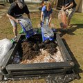 Cheryl Dennis, left, and Chris Hartley, right, join Ellen Smith, director of the Washington County H...