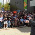Political author and commentator Dick Morris speaks Thursday to a group assembled at a rally organiz...