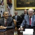 President Barack Obama sits next to Paul Volcker, chairman of the President's Economic Recovery Advi...