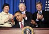President Barack Obama signs a memorandum establishing the Great Outdoors Initiative Friday at the White House Conference on America's Great Outdoors in Washington. Behind the president Environmental Protection Agency Administrator Lisa Jackson, Interior Secretary Ken Salazar and Agriculture Secretary Tom Vilsack watch.