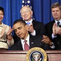 President Barack Obama signs a memorandum establishing the Great Outdoors Initiative Friday at the W...