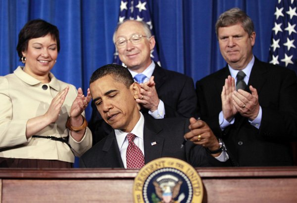 president-barack-obama-signs-a-memorandum-establishing-the-great-outdoors-initiative-friday-at-the-white-house-conference-on-americas-great-outdoors-in-washington-behind-the-president-environmental-protection-agency-administrator-lisa-jackson-interior-secretary-ken-salazar-and-agriculture-secretary-tom-vilsack-watch