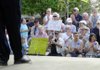 Participants in a Tax Day Tea Party Rally applaud Thursday at the Frisco Stage in downtown Rogers. The Benton County Tea Party hosted the event which featured a number of speakers including politicians in coming elections and concerned political activists. For a related report, see today’s Arkansas Democrat-Gazette.