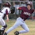  Siloam Springs catcher Zach Houston, left, runs down Huntsville’s Mac Adkins for an out in the firs...
