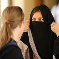  Jamilah Hashemi, a former resident of Saudi Arabia, right, describes the abaya to Alexa Naumovich, ...