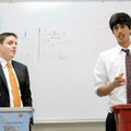  Mason Moser, left, of Rogers Heritage High School, debates Bilal Tanseem of Little Rock Central Hig...