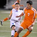  Rogers High’s Cesar Merlos, left, battles for control of the ball Friday with Rogers Heritage’s Jos...