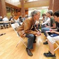 Art Hobson, left, is interviewed by Nicholas Brown, 11, as the two participate in the Fayetteville F...