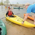 Steven Warriner, right, a University of Arkansas student from Conway, helps Megan Hudgens of Lincoln...