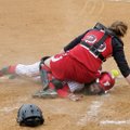 Farmington’s Teighlor Williams slides under Dardanelle catcher Brittany Battenfield to score a run d...