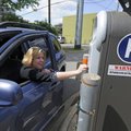 Jamie Daniels of Farmington pays to park in a Fayetteville municipal lot Monday. About 20 of these p...