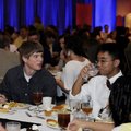 Springdale High School students Nicholas Hopkins, left, and Simon Luangsisombath eat dinner Monday d...