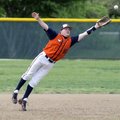 Rogers Heritage third baseman Brandon Brzozkiewicz stretches to make a catch during Tuesday’s game a...