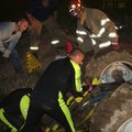 Emergency personnel from Rogers and Avoca fire departments work Monday evening for more than an hour...