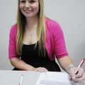 Springdale High’s Chloe Brown smiles after signing a letter of intent to play softball at Missouri S...