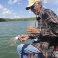 Ford McIntosh of Rogers lands a Beaver Lake crappie.