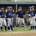 Springdale Har-Ber coach Lynn Lawson looks toward the infield while a Fayetteville relief pitcher wa...
