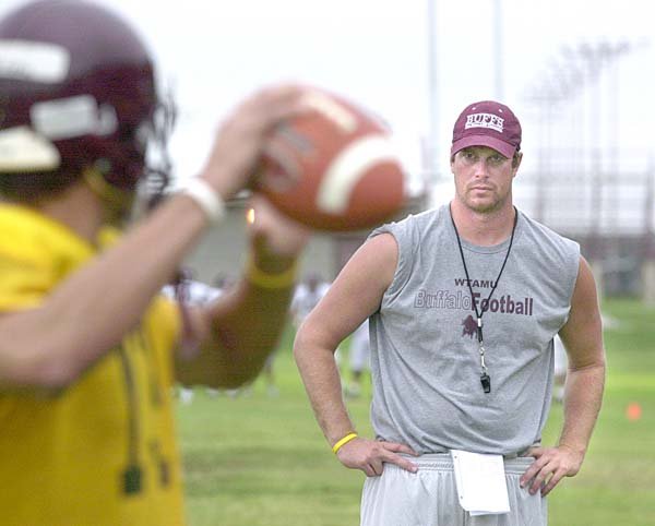 former-nfl-quarterback-ryan-leaf-the-new-quarterbacks-coach-at-west-texas-am-university-works-with-the-offense-during-football-practice-wednesday-aug-15-2006-in-amarillo-texas