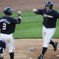  Northwest Arkansas’ Mike Moustakas crosses home plate and celebrates his home run with Johnny Giavo...