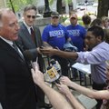 Benton County Judge Dave Bisbee, left, speaks Thursday on the steps of the Benton County Courthouse ...