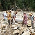  Workers have come from as far away as France to create a 13th century castle from stone quarried on...