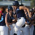  Springdale Har-Ber’s Brittany Rodgers, center, is greeted at the plate after hitting a solo home ru...