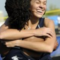 Springdale Har-Ber senior Kirstie Hesseltine, right, embraces teammate Summer Morgan after her recor...