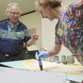 ALLURING ACRYLIC ABSTRACT - Douglas Walton, left, of Ruston, La., works with Janis Ward of Fayettevi...