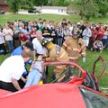 SOBERING LESSON - Greenland High School freshman Emily Sherer is removed Friday from a wrecked car b...