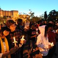CANDLELIGHT VIGIL - University of Arkansas students Stacy Tan, a junior from Malaysia, and boyfriend...