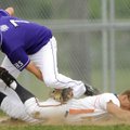 Rogers Heritage’s Reed Brown beats the tag by Fayetteville first baseman Clarke Smithson on a pickof...