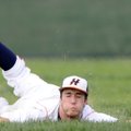 Rogers Heritage’s Zac Stewart dives to stop a one-hopper in shallow right field Friday during the Wa...