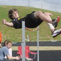 Prairie Grove sophomore Adam Mesenbrink competes in the high jump Friday at the 4A-1 District Track ...