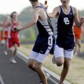 Shiloh Christian freshman Danile Evans hands the baton to senior Andrew Evans as they run in the 4x8...