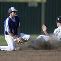 Fayetteville’s T.J. Foster, right, slides into second base as the ball pops out of the glove of Roge...