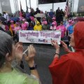 Cancer survivors get a rousing round of applause Saturday during the annual Susan G. Komen Race for ...