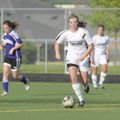 Bentonville’s Holyn Marshall moves the ball up the field during an April 15 game against Fayettevill...