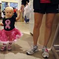 Sydney Walker, 1, walks Saturday morning with her mother, Jasmine Walker of Bentonville, through the...
