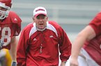 Arkansas Coach Bobby Petrino yells instructions to his players during practice April 21 in Fayetteville.