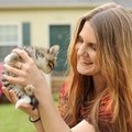 Meghan Gallo of Fayetteville, a University of Arkansas law student, holds one of several kittens Fri...