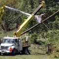 Utility companies remove damaged power poles around Yazoo City, Miss. Sunday following Saturday's to...