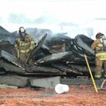 Bentonville firefighters work to put out a fire that started Monday morning at an Arvest Bank branch...