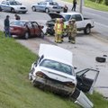 Springdale emergency workers look over the accident scene Monday after clearing the injured in a thr...
