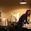Volunteer Alison Demorotski of Elm Springs prepares historical photographs for storage in the collec...