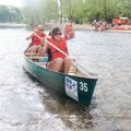 Hallie Aenchbacher, stern, and Sophie Cosgriff head down the Elk River during a Bentonville High Sch...